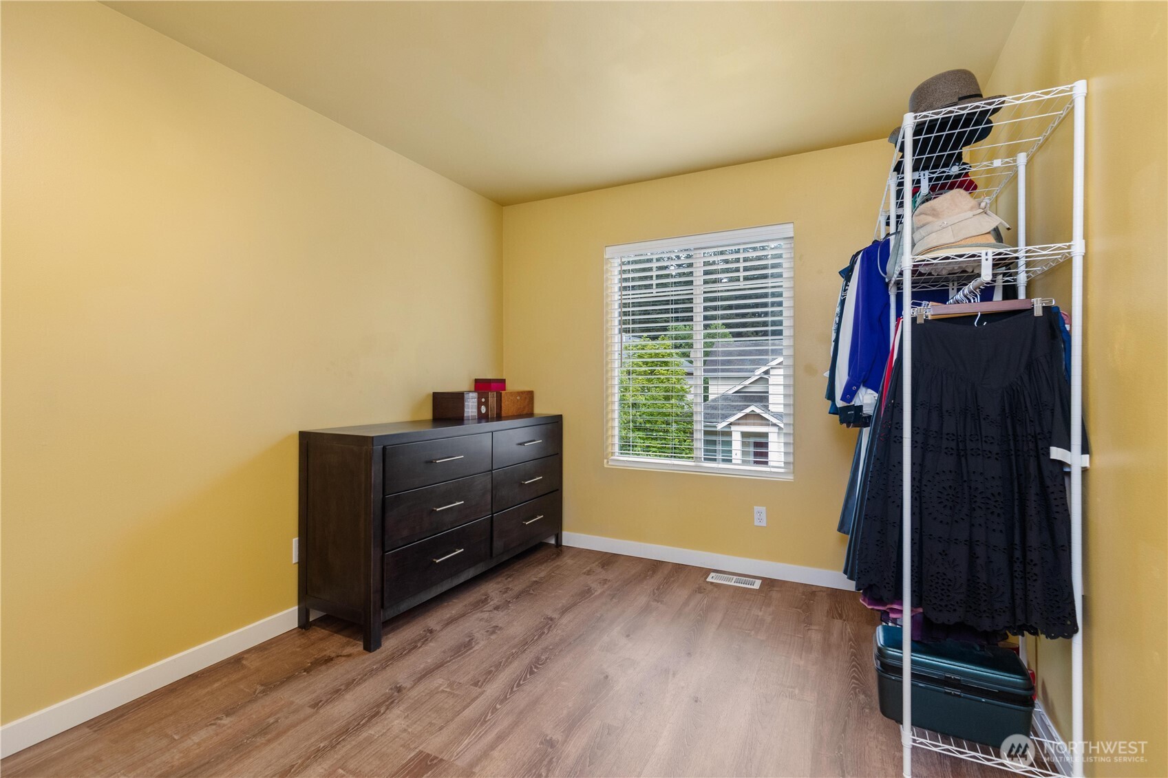 28104 Maple Ridge Way Southeast Maple Valley, WA 98038 - Photo 19 of 26 a room with a window and wooden floor