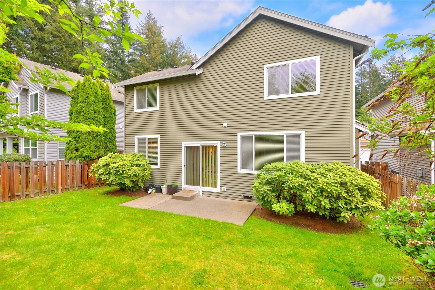 28104 Maple Ridge Way Southeast Maple Valley, WA 98038 - Photo 23 of 26 front view of a house with a yard