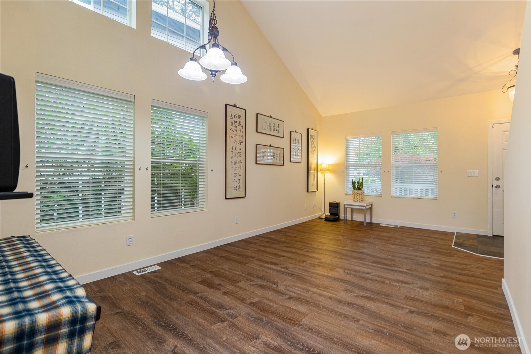 28104 Maple Ridge Way Southeast Maple Valley, WA 98038 - Photo 4 of 26 a view of an empty room with a window and wooden floor