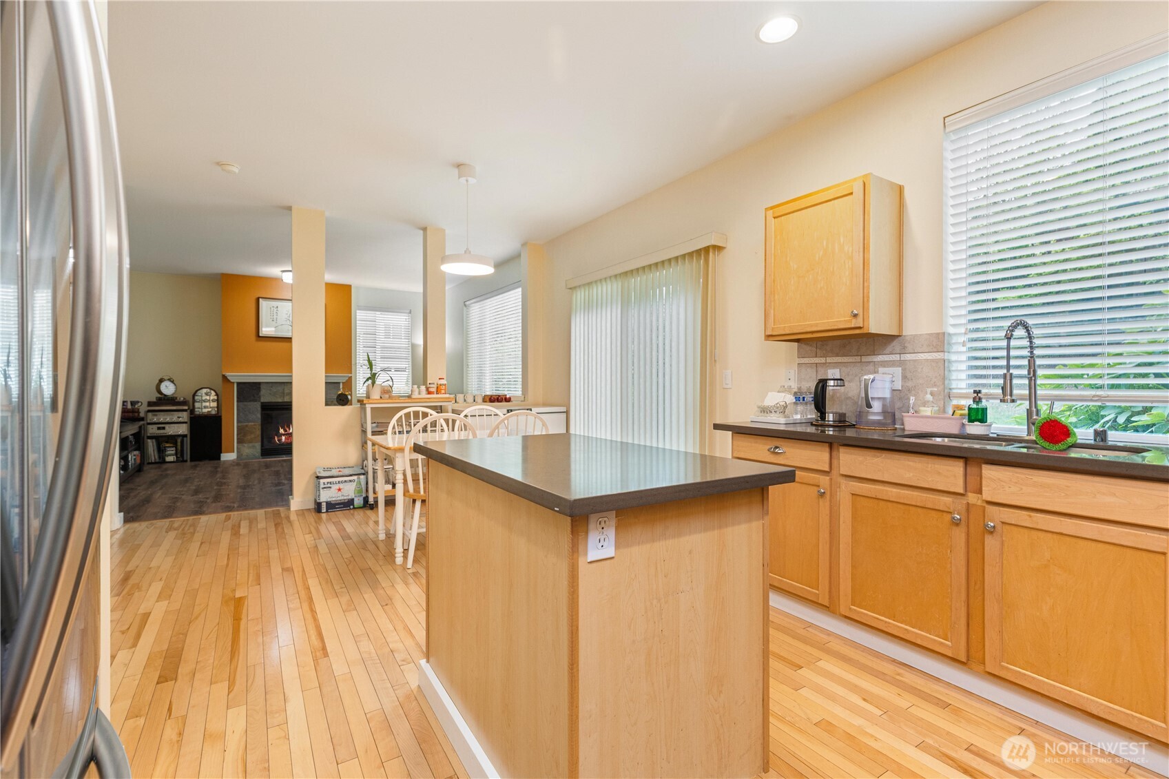 28104 Maple Ridge Way Southeast Maple Valley, WA 98038 - Photo 7 of 26 a large kitchen with a lot of counter space and a wooden floor