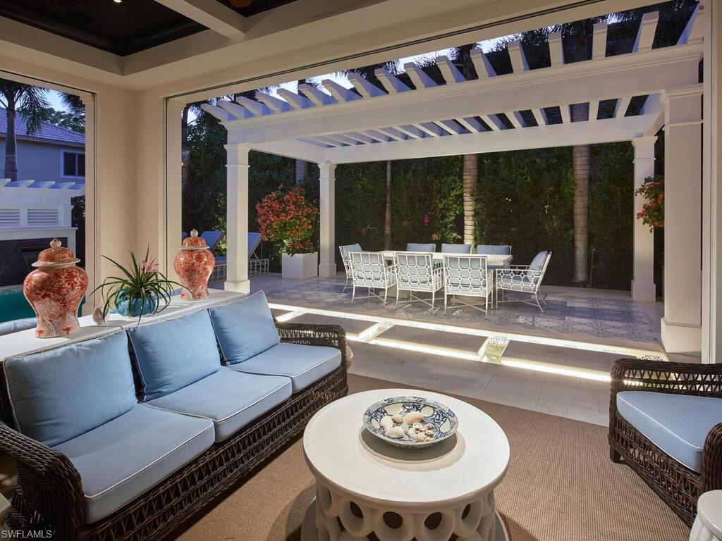 167 4th Street North Naples, FL 34102 - Photo 25 of 33 a living room with furniture and a large window