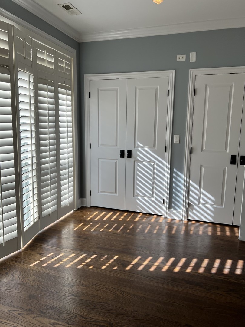 Undisclosed Address Chicago, IL 60614 - Photo 16 of 22 a view of a room with wooden floor and windows