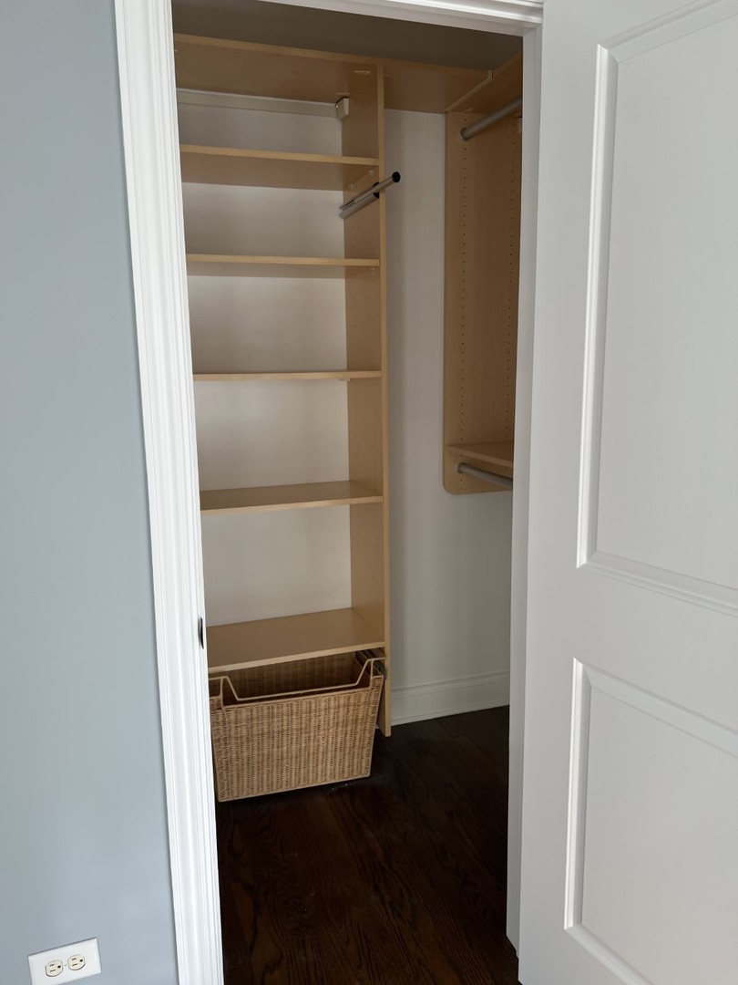Undisclosed Address Chicago, IL 60614 - Photo 17 of 22 a view of walk in closet with empty racks
