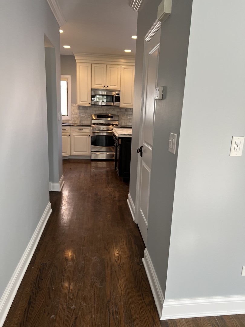Undisclosed Address Chicago, IL 60614 - Photo 8 of 22 a kitchen with stainless steel appliances a refrigerator and a stove top oven