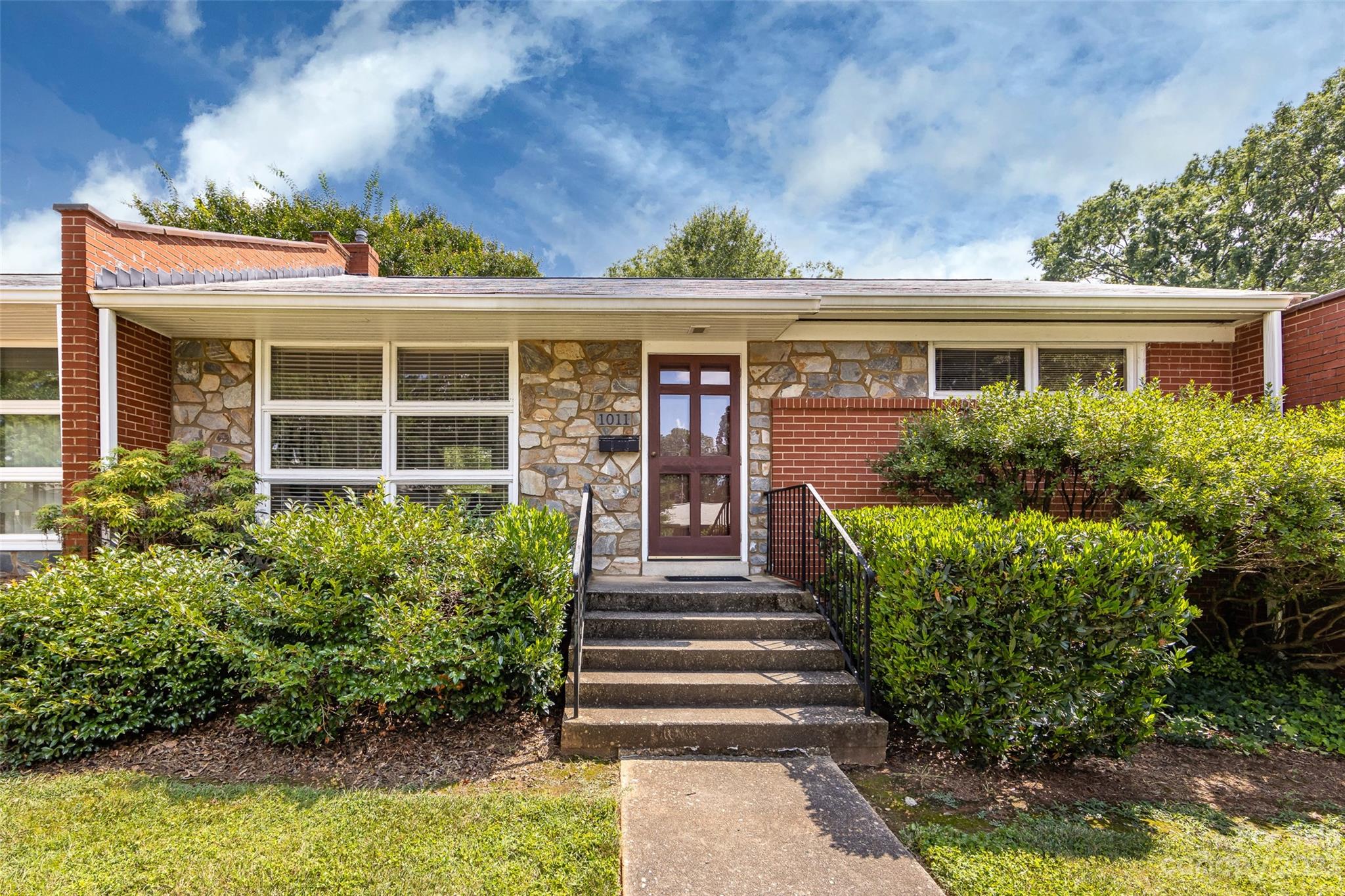 1011 Andover Road Charlotte, NC 28211 - Photo 1 of 29 front view of a house with a yard