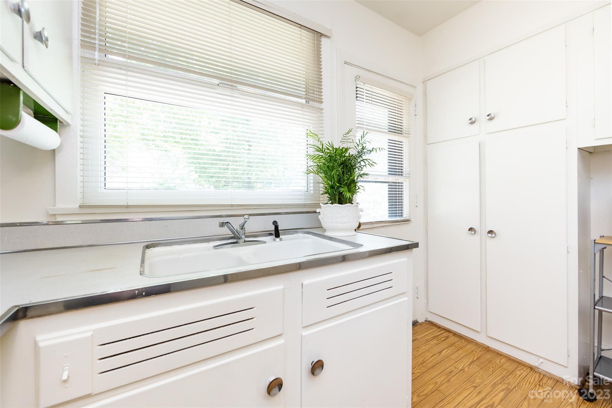 1011 Andover Road Charlotte, NC 28211 - Photo 14 of 29 a bathroom with a granite countertop sink and a window