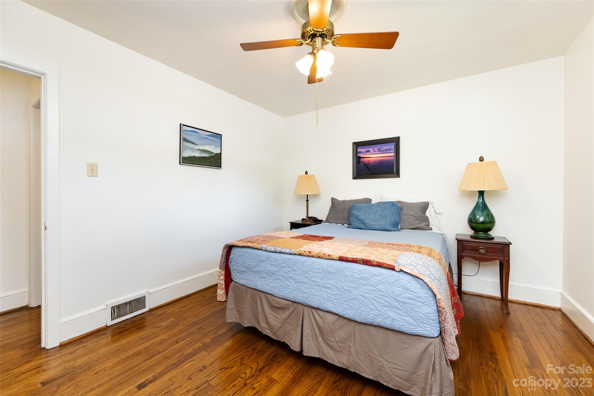 1011 Andover Road Charlotte, NC 28211 - Photo 19 of 29 a bedroom with bed and wooden floor