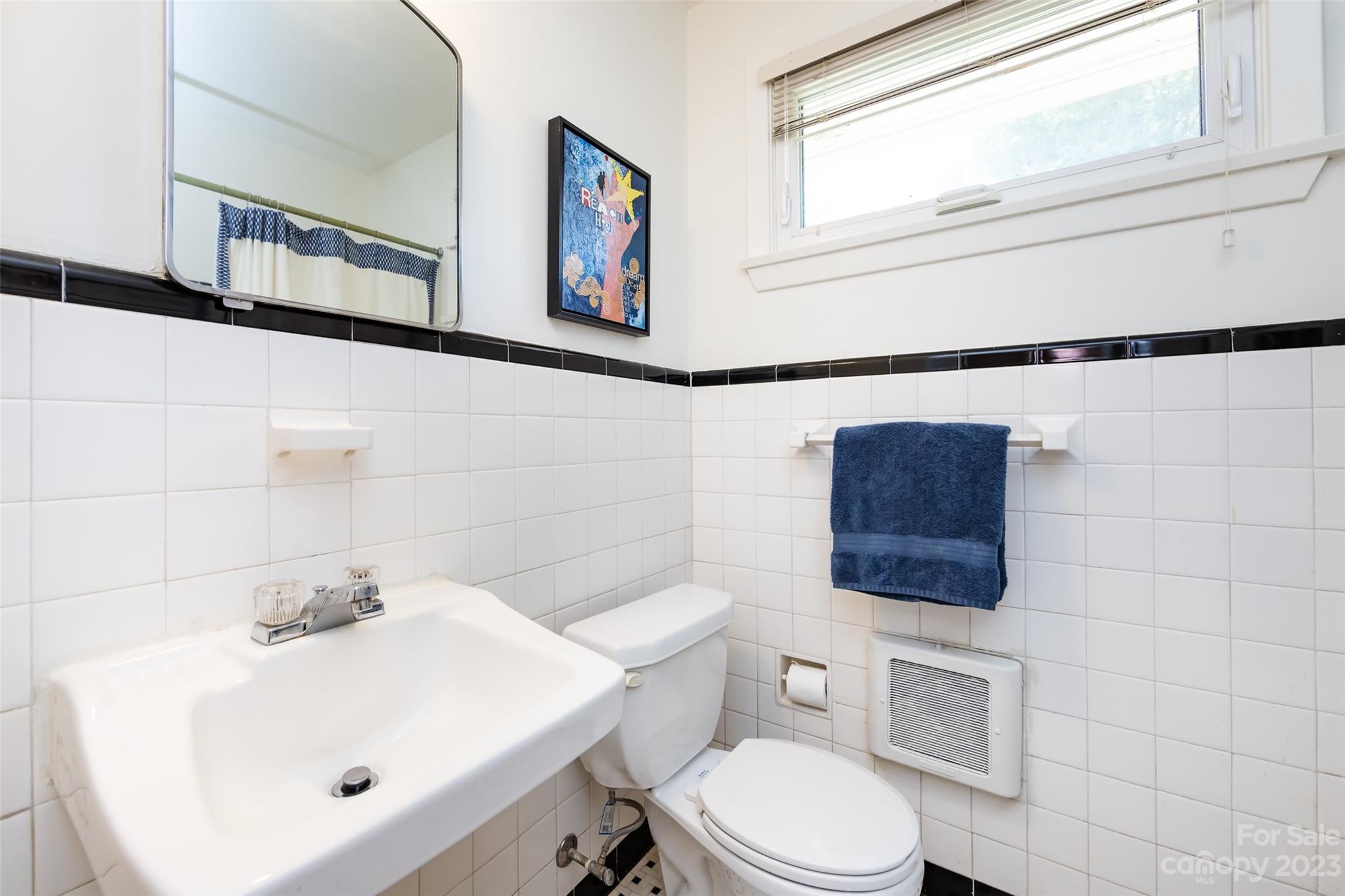 1011 Andover Road Charlotte, NC 28211 - Photo 22 of 29 a bathroom with a sink mirror and toilet