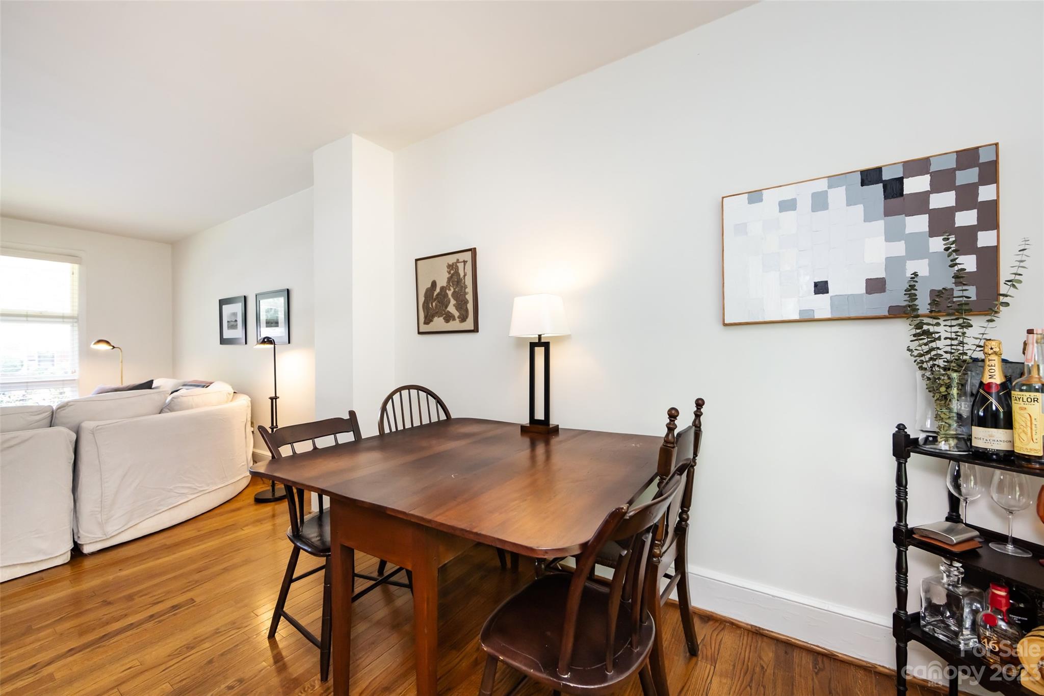 1011 Andover Road Charlotte, NC 28211 - Photo 9 of 29 a view of a dining room with furniture and wooden floor