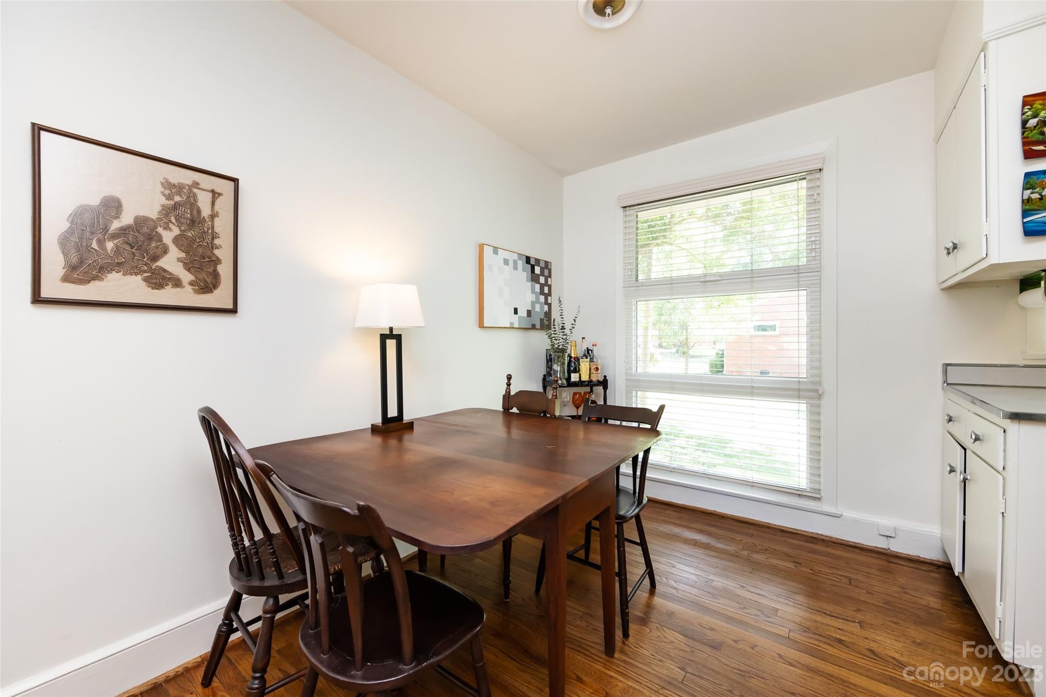 1011 Andover Road Charlotte, NC 28211 - Photo 10 of 29 a view of a dining room with furniture and wooden floor
