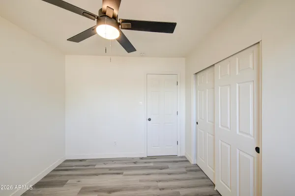 a view of room with hardwood floor