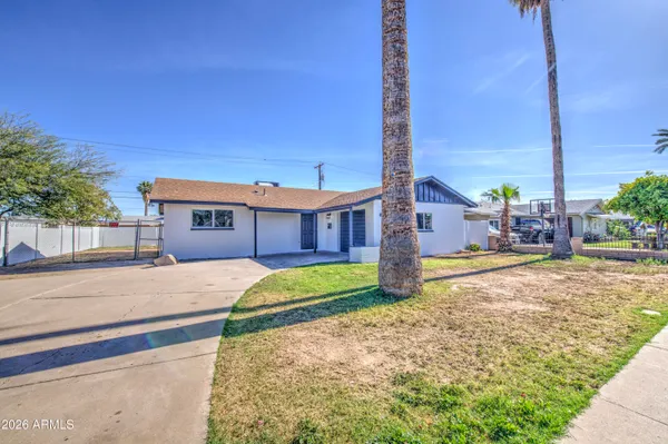 a house view with a backyard space