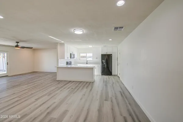 a view of kitchen with wooden floor