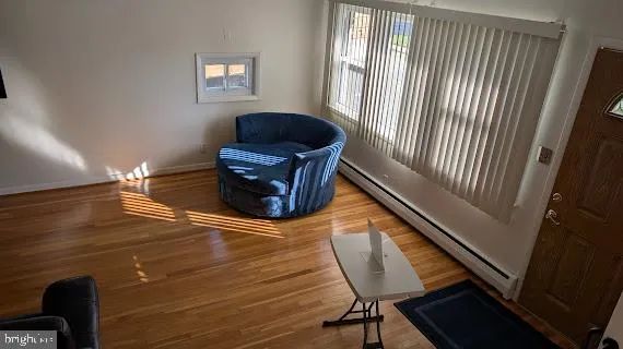 a room with wooden floor and chair