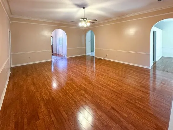 a view of a room with wooden floor