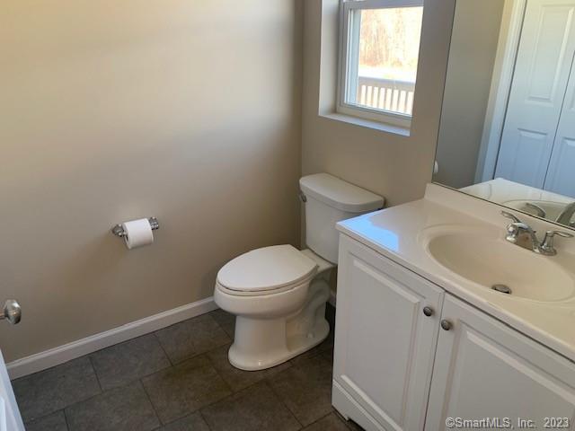 27 Tridell Drive, Unit 14 Plantsville, CT 06479 - Photo 6 of 12 a white toilet sitting next to a bathroom sink