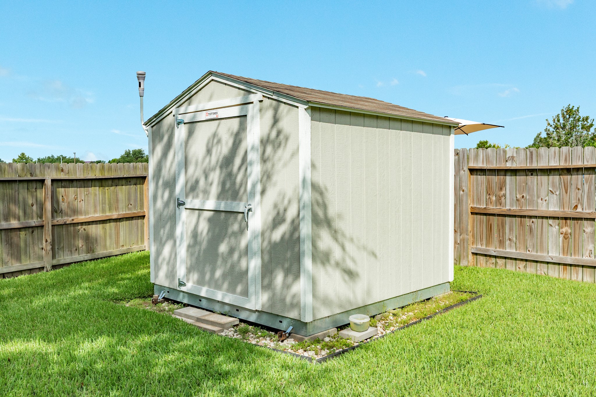 13808 Stark Bridge Lane Rosharon, TX 77583 - Photo 25 of 39 Perfect for your lawn equipment and outdoor toys, this spacious storage shed will remain with the property for your convenience.