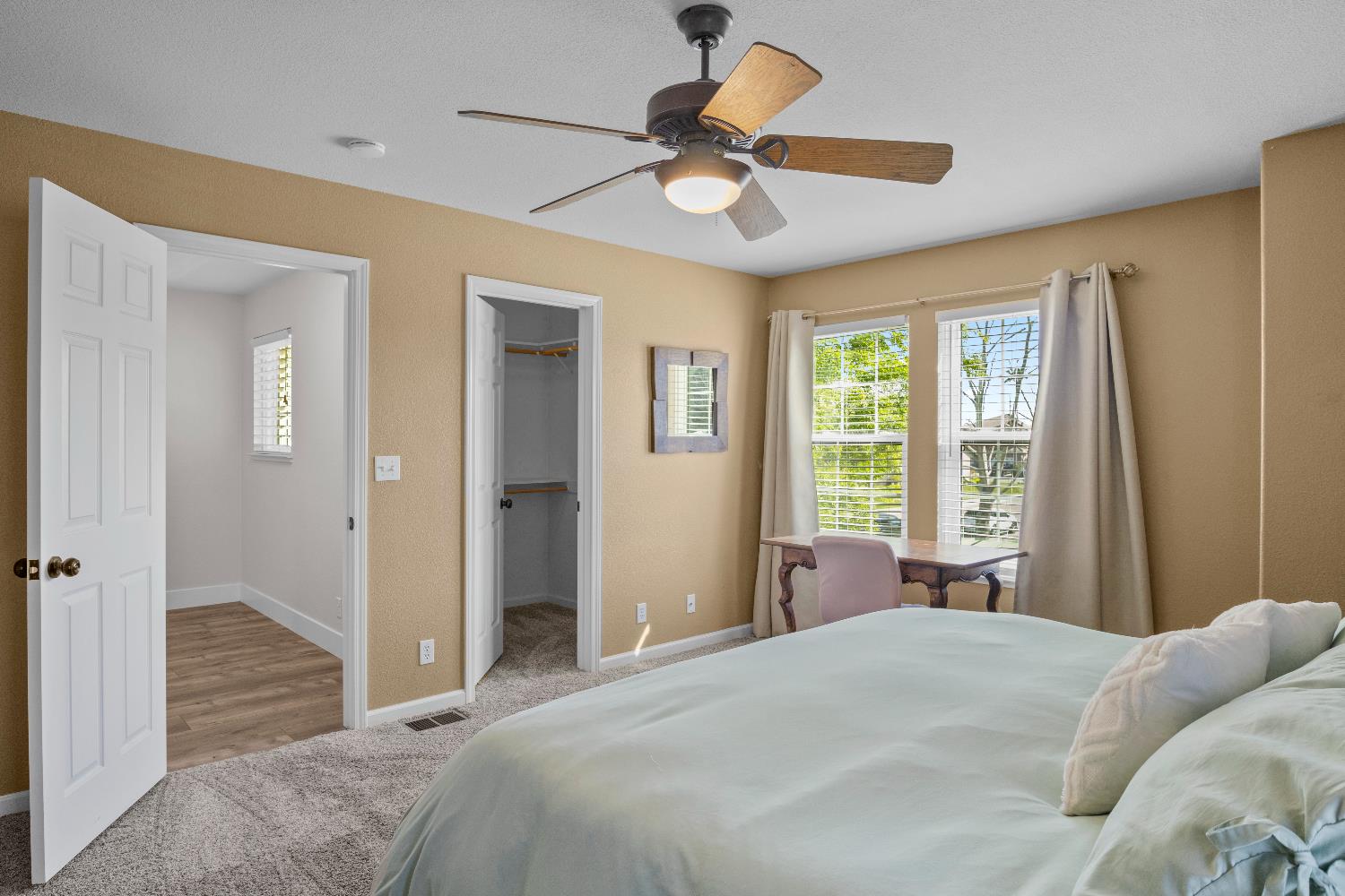 637 Rebekah Court Ripon, CA 95366 - Photo 38 of 69 a bedroom with a bed and a chandelier