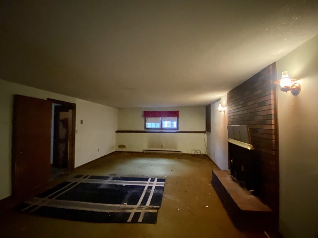 16 Peabody Road Shirley, MA 01464 - Photo 11 of 20 a view of an empty room with a fireplace
