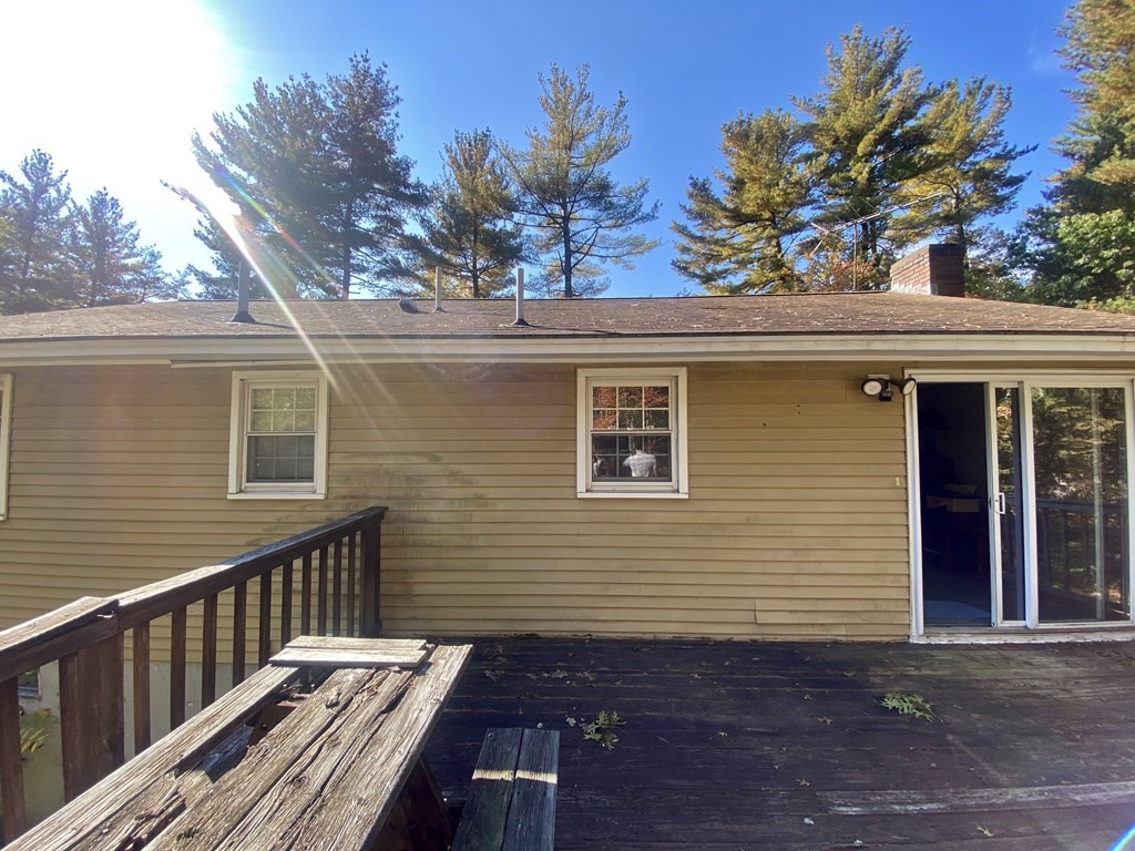 16 Peabody Road Shirley, MA 01464 - Photo 18 of 20 a view of a house with a small yard and potted plants