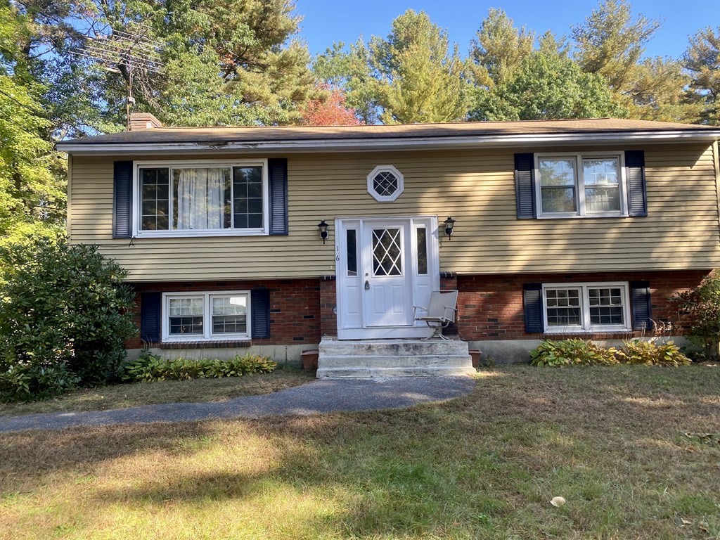 16 Peabody Road Shirley, MA 01464 - Photo 3 of 20 a front view of a house with a yard