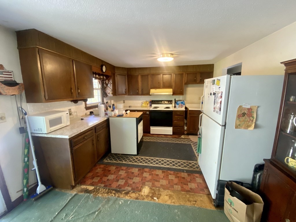 16 Peabody Road Shirley, MA 01464 - Photo 4 of 20 a kitchen with a sink appliances and cabinets
