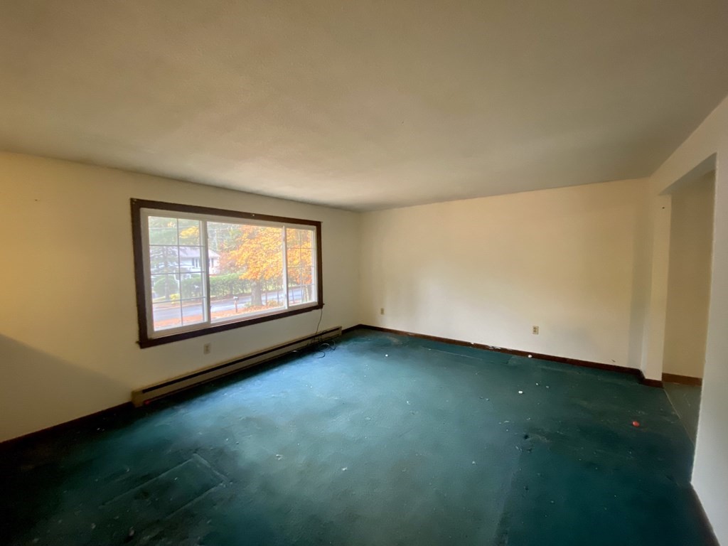16 Peabody Road Shirley, MA 01464 - Photo 8 of 20 a view of an empty room with window and garden