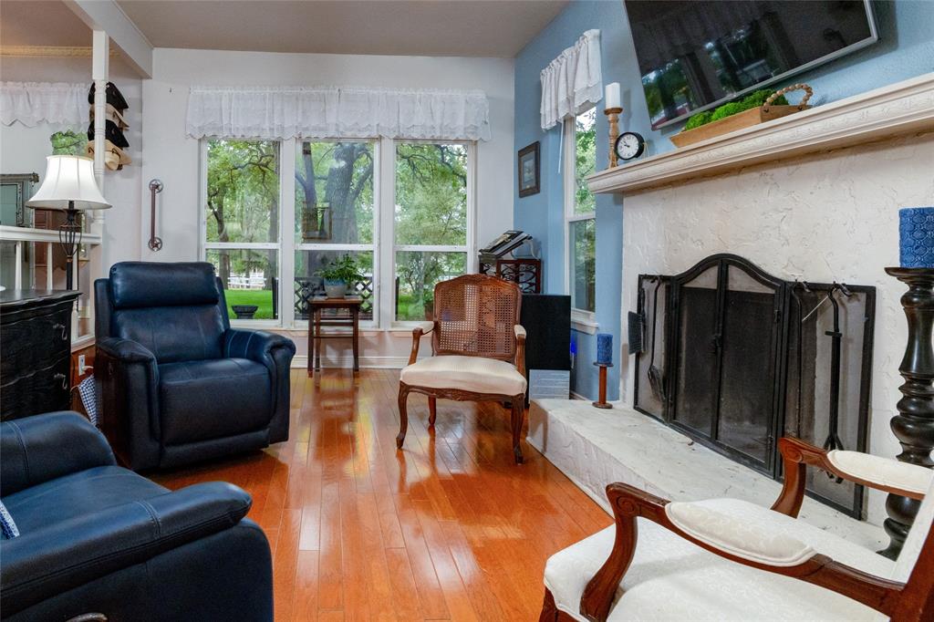 1311 Mount Gilead Road Keller, TX 76262 - Photo 12 of 40 Rich floors and a classic fireplace. Simple and inviting.
