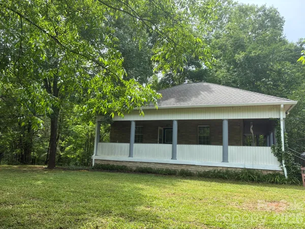 a view of a house with a garden