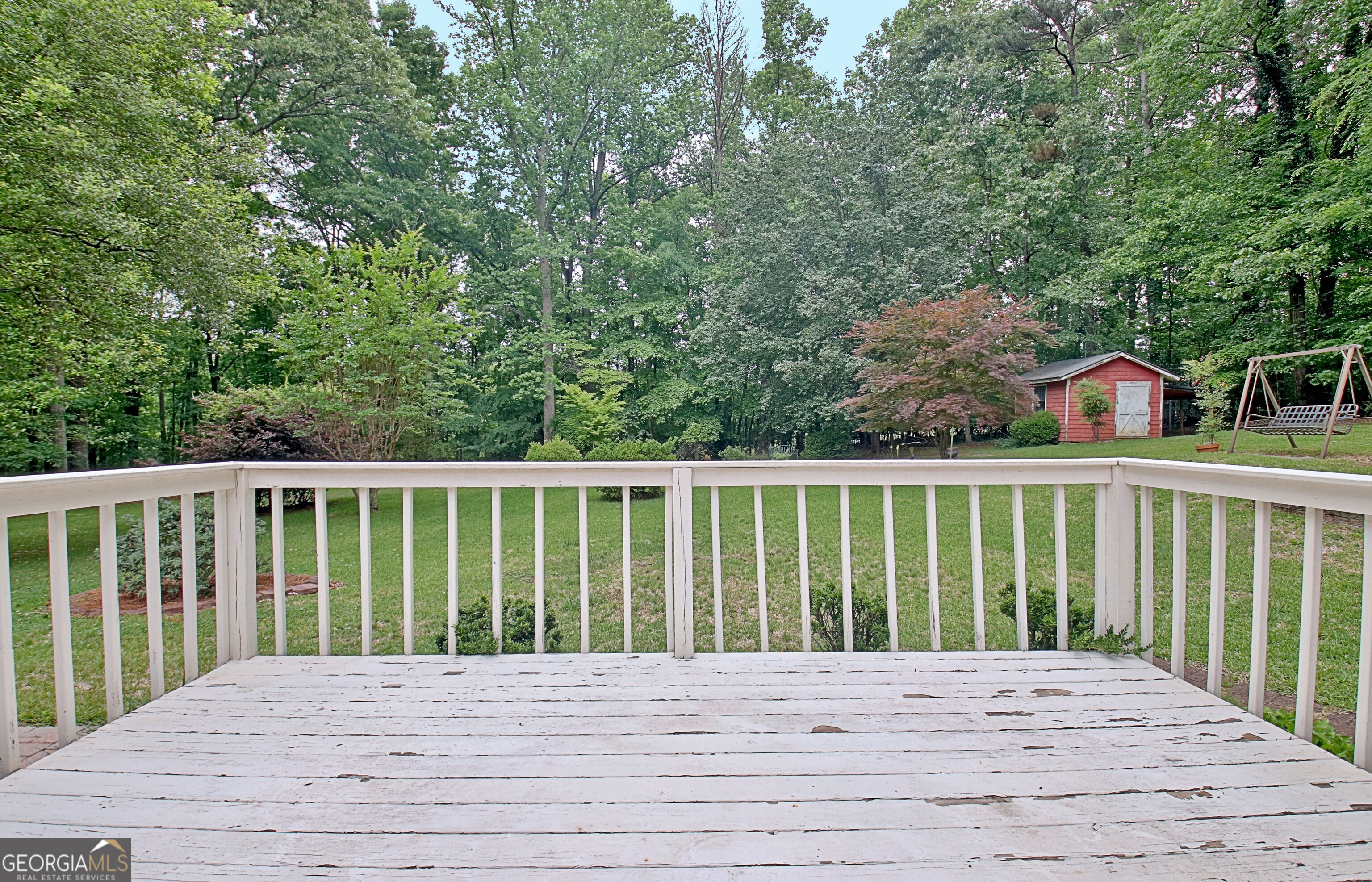 717 Tyrone Road Tyrone, GA 30290 - Photo 46 of 58 a view of balcony with wooden floor and fence