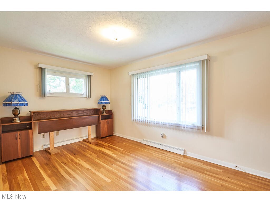 211 Benson Road Akron, OH 44333 - Photo 14 of 30 Master bedroom with hardwood floors and walk in closet
