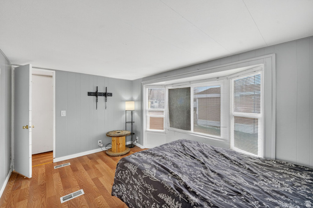 24 Grover Street Layton, UT 84041 - Photo 20 of 21 Bedroom with wood finished floors and wooden walls