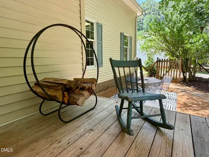 a view of a backyard with sitting area and garden