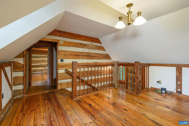 a view of an empty room with a fireplace
