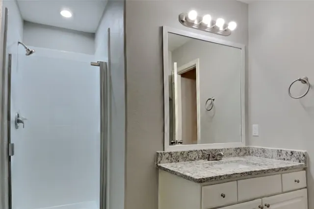 a view of an empty room and a window