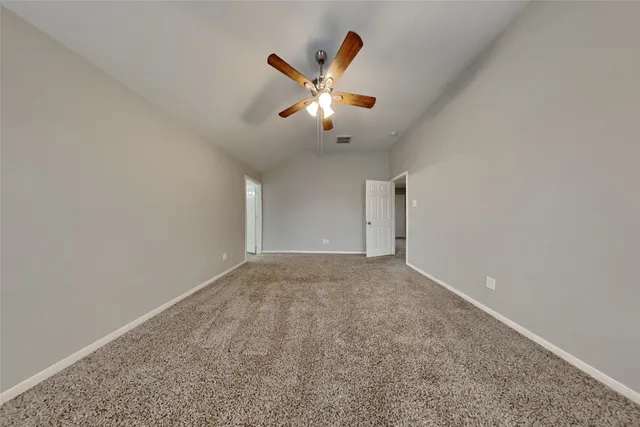 a bathroom with a granite countertop sink a large mirror and a bathtub