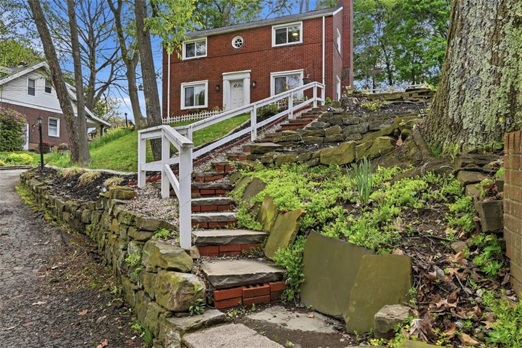 315 Woodside Road Pittsburgh, PA 15221 - Photo 46 of 46 front view of a house with a tree