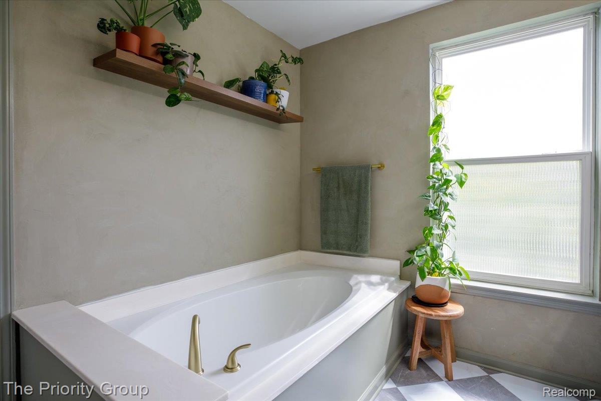 517 Deer Valley Road Holly, MI 48442 - Photo 36 of 61 A very zen bathtub with a seperate shower