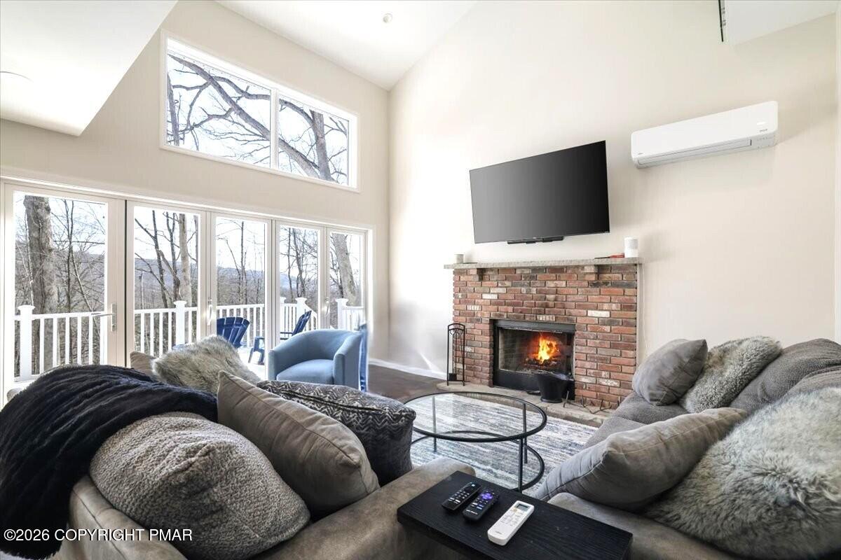 5873 Decker Road Bushkill, PA 18324 - Photo 2 of 57 a living room with furniture fireplace and flat screen tv