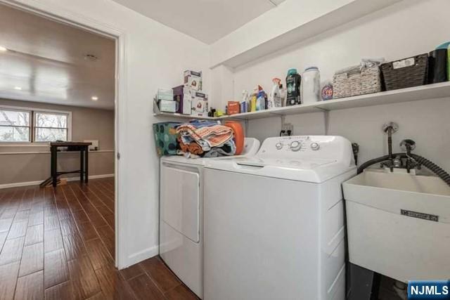 23 Asmus Road Closter, NJ 07624 - Photo 28 of 38 a utility room with dryer washer and storage