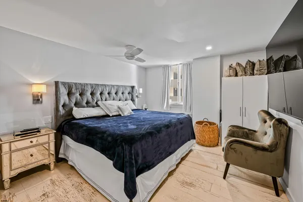 a bed room with a bed and a chair