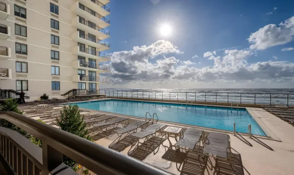 a view of swimming pool from a balcony
