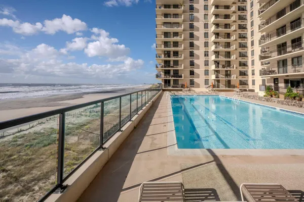 a view of balcony with wooden floor and fence