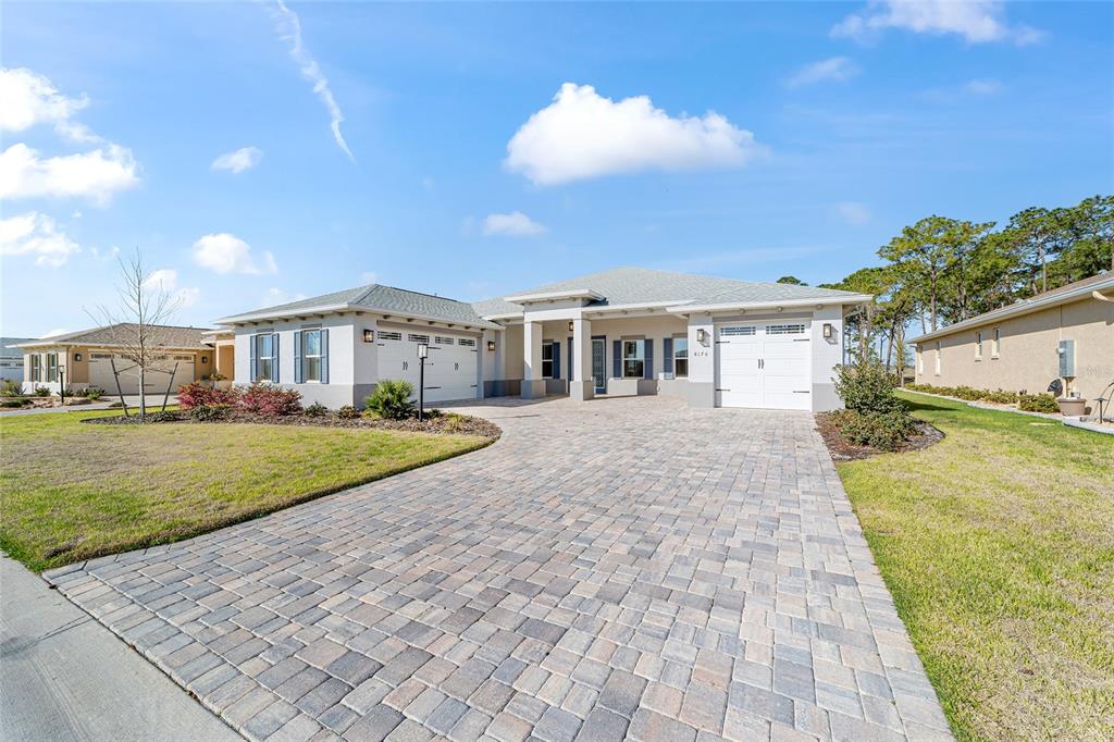 8176 Southwest 98th Terrace Road Ocala, FL 34481 - Photo 2 of 62 a view of house with yard and entertaining space