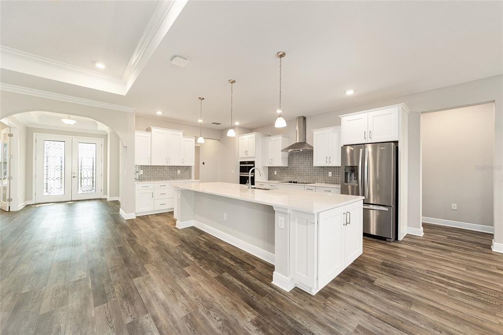 8176 Southwest 98th Terrace Road Ocala, FL 34481 - Photo 22 of 62 a large kitchen with stainless steel appliances kitchen island a large island in the center