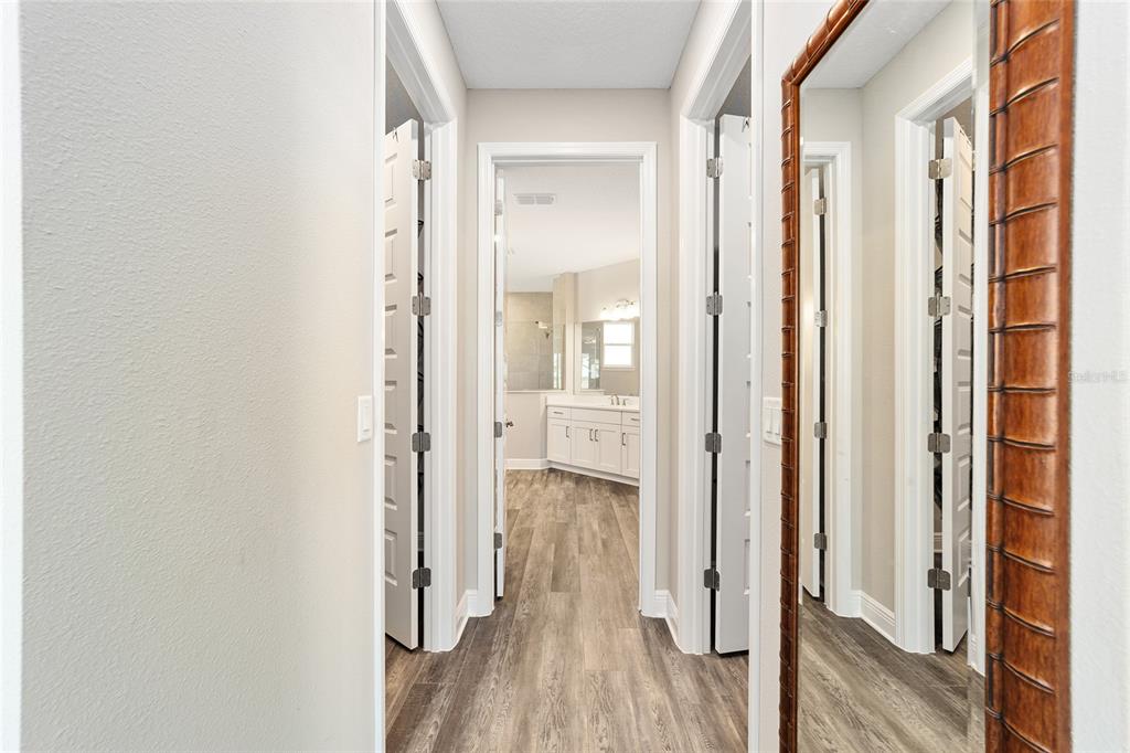 8176 Southwest 98th Terrace Road Ocala, FL 34481 - Photo 31 of 62 a view of a bathroom with wooden floor and a glass door