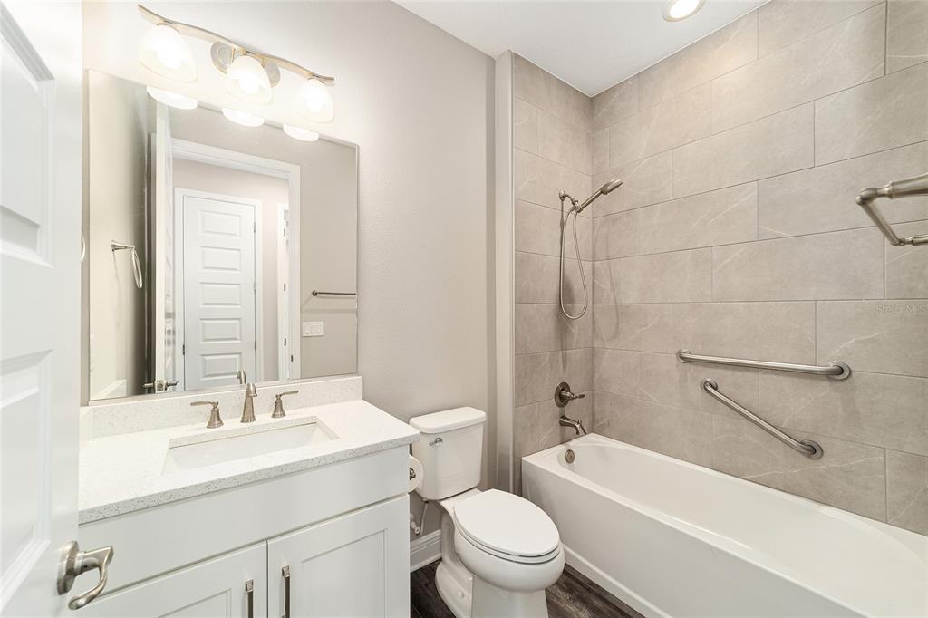 8176 Southwest 98th Terrace Road Ocala, FL 34481 - Photo 43 of 62 a bathroom with a sink a toilet and shower