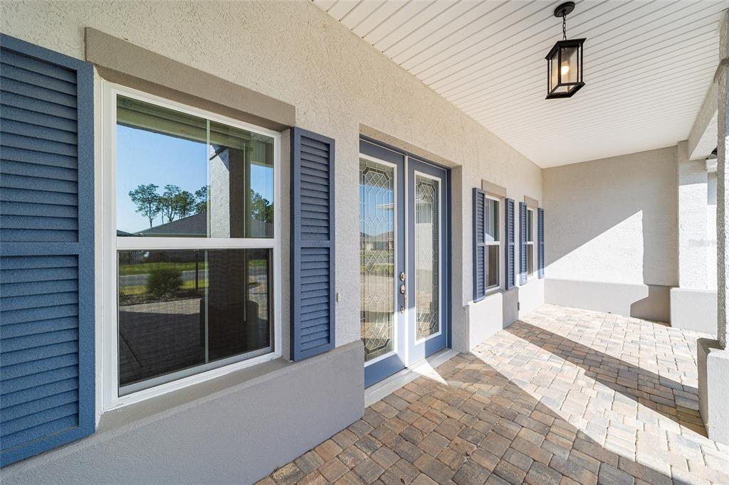 8176 Southwest 98th Terrace Road Ocala, FL 34481 - Photo 9 of 62 a view of a hallway with wooden floor and windows