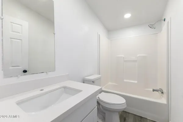 a bathroom with a sink a toilet and a bathtub