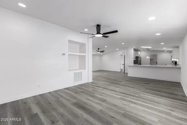 a view of a kitchen with a sink and a refrigerator